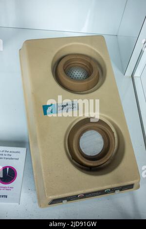An Anderson Jacobson A242 acoustic coupler (1975) allowing a computer to be connected to a phone on display in a media museum. Stock Photo