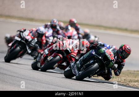 Hohenstein Ernstthal, Germany. 19th June, 2022. Motorsport/Motorcycle: German Grand Prix, MotoGP, Race, Fabio Quartararo (r/No. 20) from France of the Monster Energy Yamaha MotoGP Team leads the field of riders. Credit: Jan Woitas/dpa/Alamy Live News Stock Photo