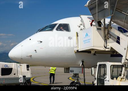 Podgorica, Montenegro - June 3, 2022: Passenger plane of Polish airlines LOT at the airport in Podgorica in Montenegro Stock Photo