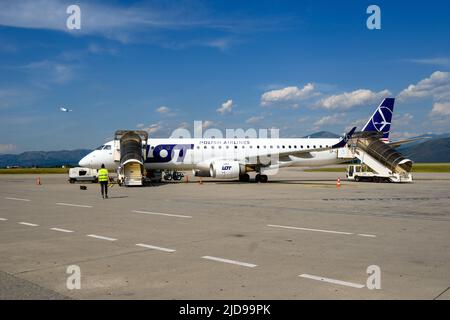 Podgorica, Montenegro - June 3, 2022: Passenger plane of Polish airlines LOT at the airport in Podgorica in Montenegro Stock Photo