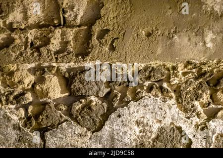 Rough unfinished texture on the outside on the concrete cement wall Stock Photo