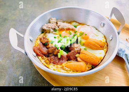 fried egg with tomato bacon in pan breakfast morning business food still life Stock Photo