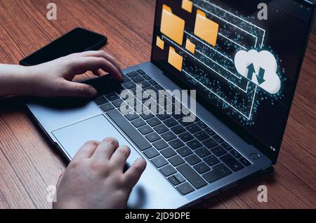 Businesswoman using a computer with cloud computing diagram. Data storage. Networking and internet service concept. Stock Photo