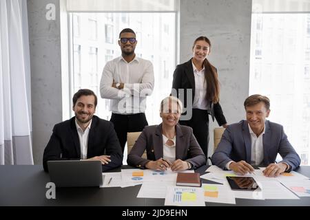 Group of diverse businesspeople posing in office for corporate picture Stock Photo