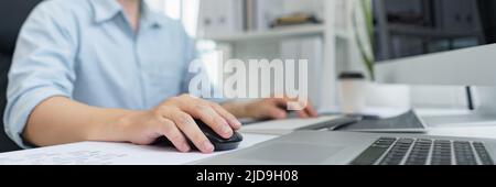 Software development concept, Male programmer typing data code on laptop to develop app and website. Stock Photo