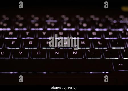 Backlit black computer keyboard at dark Stock Photo