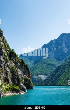 Komani Lake ferry cruise boat view near the town of Fierzë, Albania. Komani Lake is a popular tourist destination in Albania. Stock Photo