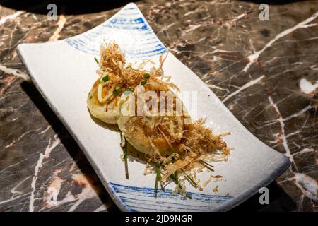 A delicious Japanese dish, pan-fried crab cakes Stock Photo
