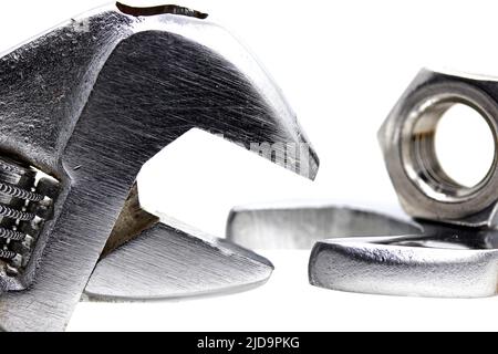 bolt nut and wrench isolated on white background Stock Photo