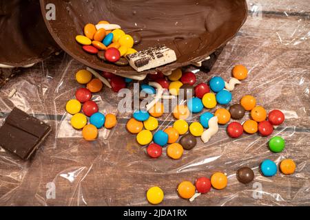 HALF AN EASTER EGG WITH COLORED CANDIES. Stock Photo