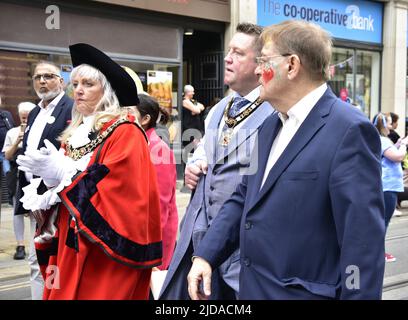 Manchester, UK, 19th June, 2022. (left) The Lord Mayor of Manchester, Councillor Donna Ludford, (2nd from right) the Lord Mayor's Consort, Councillor Sean McHale, (right) Councillor Pat Karney, Councillor for Harpurhey and Chair of Manchester Day, take part in the Manchester Day Parade, Manchester, England, United Kingdom.  Credit: Terry Waller/Alamy Live News Stock Photo