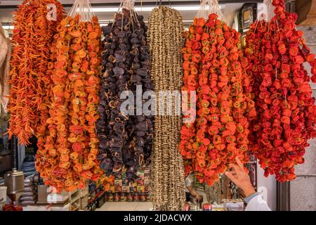 Dried bell peppers, chillies, aubergins and okra hanging on the traditional turkish food market Stock Photo