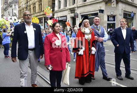 Manchester, UK, 19th June, 2022. (Centre) The Lord Mayor of Manchester, Councillor Donna Ludford, (2nd from right) the Lord Mayor's Consort, Councillor Sean McHale, (right) Councillor Pat Karney, Councillor for Harpurhey and Chair of Manchester Day, take part in the Manchester Day Parade, Manchester, England, United Kingdom.  Credit: Terry Waller/Alamy Live News Stock Photo