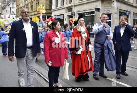 Manchester, UK, 19th June, 2022. (Centre) The Lord Mayor of Manchester, Councillor Donna Ludford, (2nd from right) the Lord Mayor's Consort, Councillor Sean McHale, (right) Councillor Pat Karney, Councillor for Harpurhey and Chair of Manchester Day, take part in the Manchester Day Parade, Manchester, England, United Kingdom.  Credit: Terry Waller/Alamy Live News Stock Photo