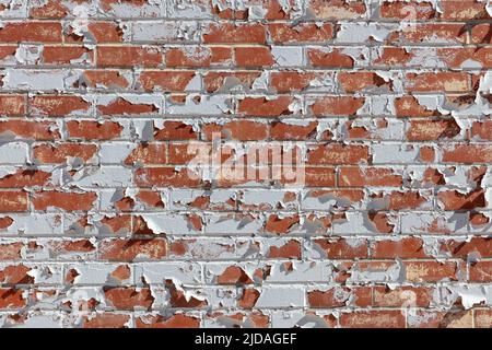 Peeling paint on old brick wall. Stock Photo