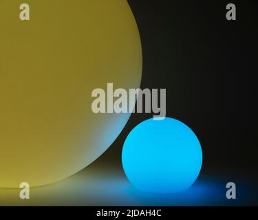 Glowing and illuminated spherical coloured orbs on a black background.