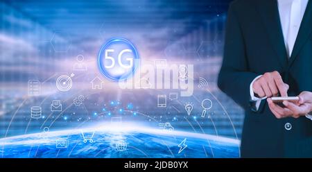 Hands of business man use mobile phone connect social media with internet. close up businessman working with smart phone in office with virtual icon d Stock Photo