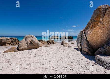 Large boulders and sandy beach at Clifton Beach on the Atlantic Ocean in Cape Town; Cape Town, Western Cape, South Africa Stock Photo