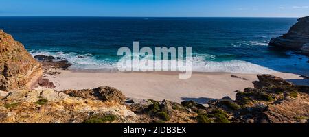 Rugged coastline and sandy beach on Diaz Beach at Cape Point along the Atlantic Ocean; Cape Town, Western Cape, South Africa Stock Photo