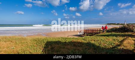 People watching the beautiful ocean waves along Dolphin Beach at Jeffrey's Bay; Eastern Cape, South Africa Stock Photo