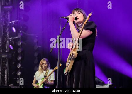 Newport, UK. 19th June, 2022. Rhian Teasdale, lead vocalist and rhythm guitarist with British indie rock band Wet Leg from the Isle of Wight UK performing live on stage at the Isle of Wight Festival. Credit: SOPA Images Limited/Alamy Live News Stock Photo