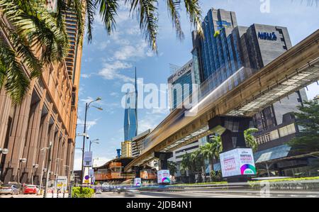Kuala Lumpur, Malaysia - June 18, 2022: Second tallest building in the world, the Merdeka 118. Street view with passing monorail train, KL 118 in his Stock Photo