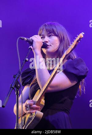 Newport, UK. 19th June, 2022. Rhian Teasdale, lead vocalist and rhythm guitarist with British indie rock band Wet Leg from the Isle of Wight UK performing live on stage at the Isle of Wight Festival. (Photo by Dawn Fletcher-Park/SOPA Images/Sipa USA) Credit: Sipa USA/Alamy Live News Stock Photo