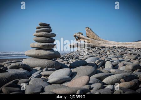 Cairn of rocks stacked on Ruby Beach on the Olympic Peninsula in the Olympic National Park in  Washington State Stock Photo