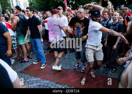 People dance and slam during the Belarusian folk-punk band Dzeciuki performance at the concert in the center of Warsaw. Belarusian musicians had a concert at the center of Warsaw as a final part for Belarusian intellectual book festival 'Pradmova' (from Belarusian it means 'foreword'). Some musicians were detained or had another kind of repression during mass protests in Belarus after the presidential elections on August 9, 2020. Because of safety reasons many Belarusian musicians, poets, writers and culture people were forced to leave the country. Some of them were forced to save their lives Stock Photo