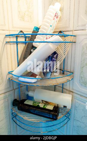 Assorted gels shampoo bottles in a shower simple corner Stock Photo