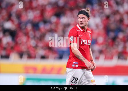 Urawa Reds' Alexander Scholz acknowledges fans after the 2023 J1