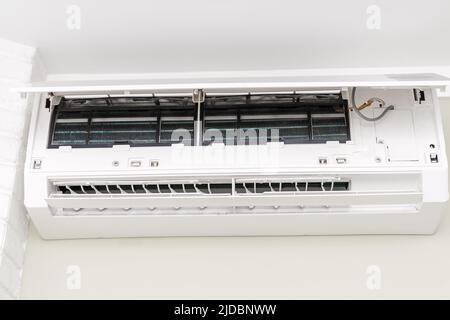 View of dirty and dusty filters on the air conditioner for washing and cleaning. Stock Photo