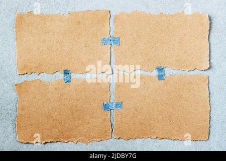 Empty aged damaged pieces of torn paper with adhesive scotch tape pieces, ripped edges Stock Photo