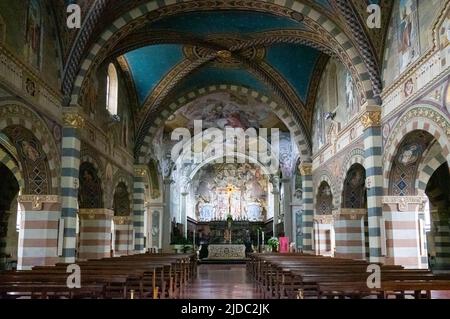 Bobbio, Italy - May 24, 2018:  The nave of the cathedral of Santa Maria Assunta with frescoes from the nineteenth century Stock Photo