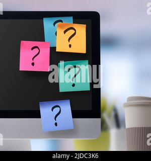 Collection of colorful sticky notes with question marks on computer screen: problem solving and creativity concept Stock Photo