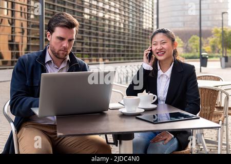 businesswoman working over coffee with a partner Stock Photo