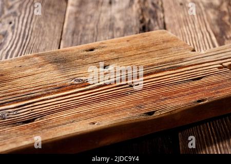 Empty cutting board on wooden table, natural podium for food product. Stock Photo