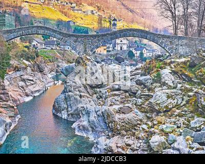 The Salt Bridge across Verzasca River during low flow, with a view on its rocky bottom and banks, Lavertezzo, Valle Verzasca, Switzerland Stock Photo