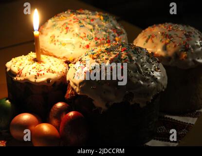 There is a beautiful candle in the dark. Easter. Spring Stock Photo