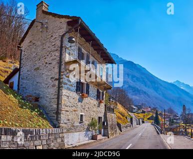 The intercity road runs through the village of Frasco, located in Valle Verzasca, Switzerland Stock Photo