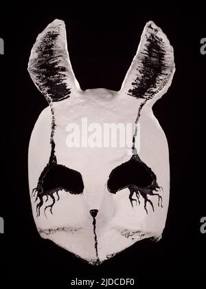 Creepy evil rabbit muzzle mask isolated on black Stock Photo