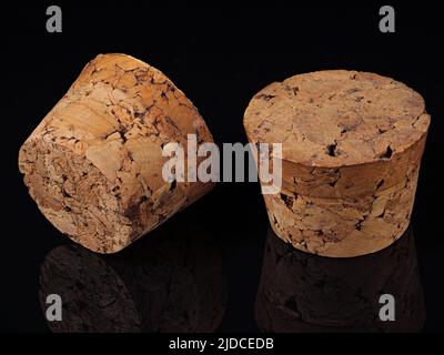 Two wine stoppers with reflection isolated on black Stock Photo
