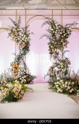 Arch for an outdoor wedding ceremony in the hall. Stock Photo