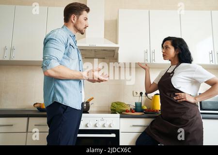 Young family couple having argument at home Stock Photo