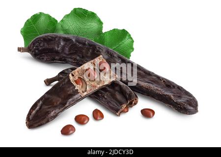 Ripe carob pods and bean isolated on white background with full depth of field Stock Photo