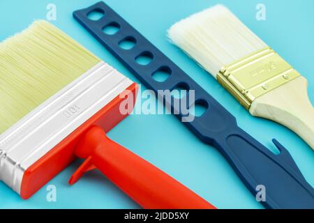 Various painting tools on blue background Stock Photo