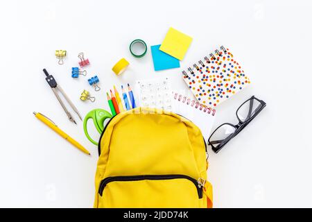 School backpack with school items and students equipment, top view Stock Photo