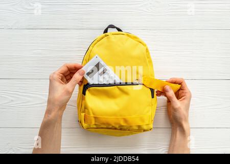 School backpack with school items and students equipment, top view Stock Photo