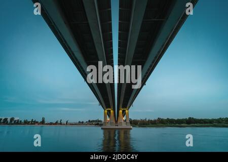 Illuminated Voroshilovsky bridge Rostov-on-Don in evening twilight in summer evening. Stock Photo