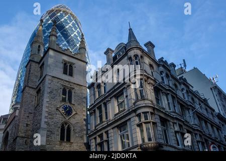 St Andrew Undershaft Church  in the City of London with 30 St Mary Axe (The Gherkin) looming behind. Stock Photo